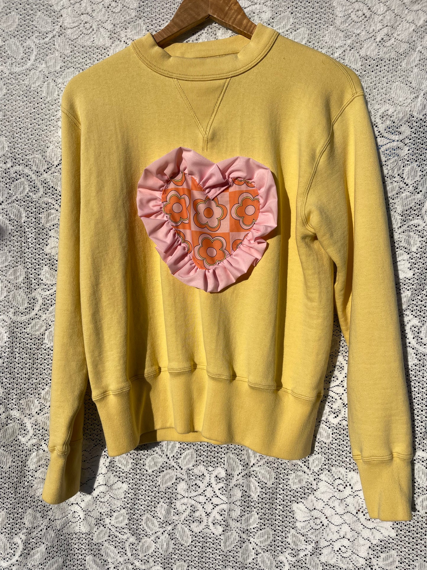 Yellow sweatshirt with ruffled heart
